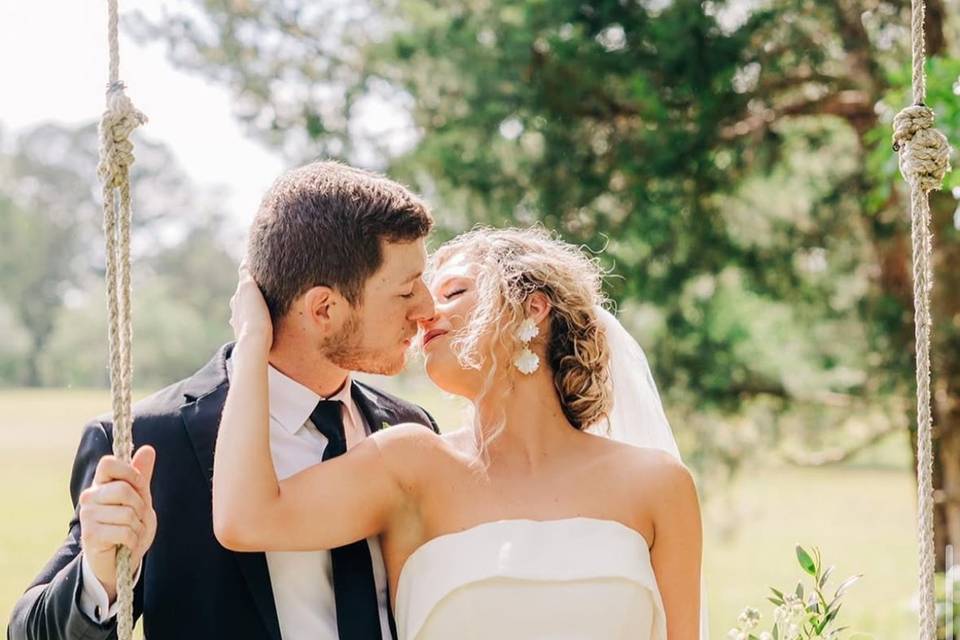 Wedding couple at swing