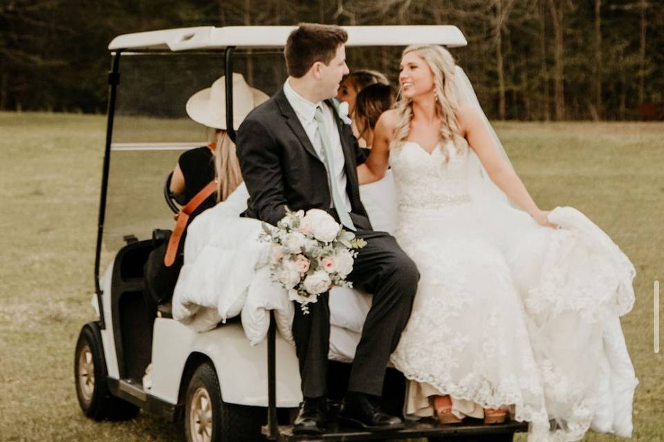 Wedding couple on golf cart
