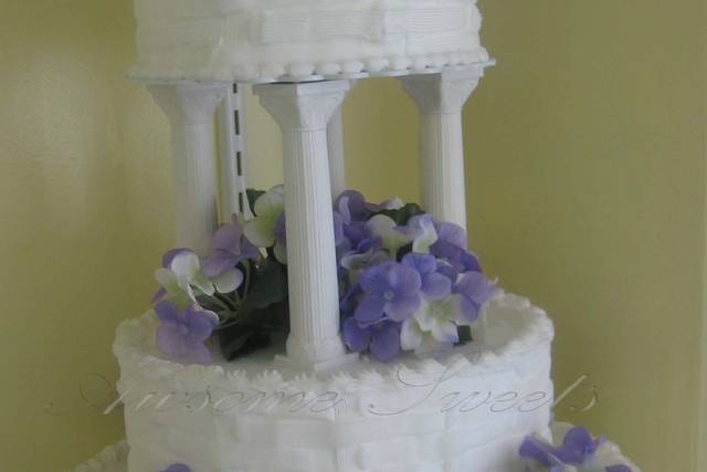 Metta's Bridal Shower cake of Stacked presents, purple shoe, purple bows,  white gumpaste bra