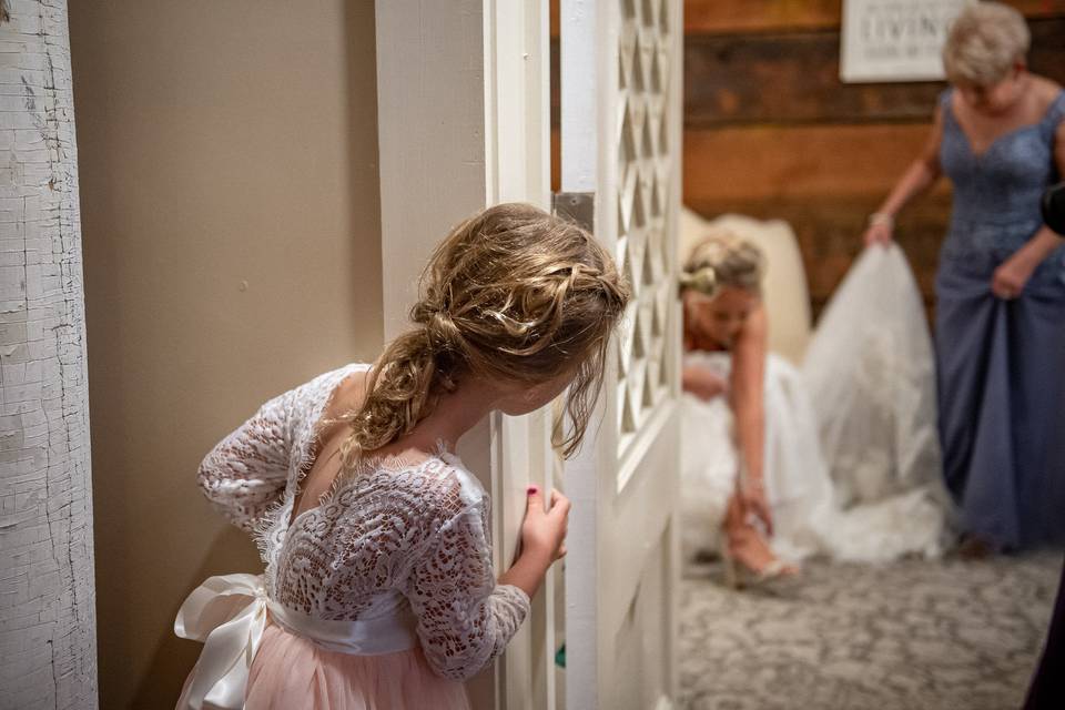 Flower girl watching bride