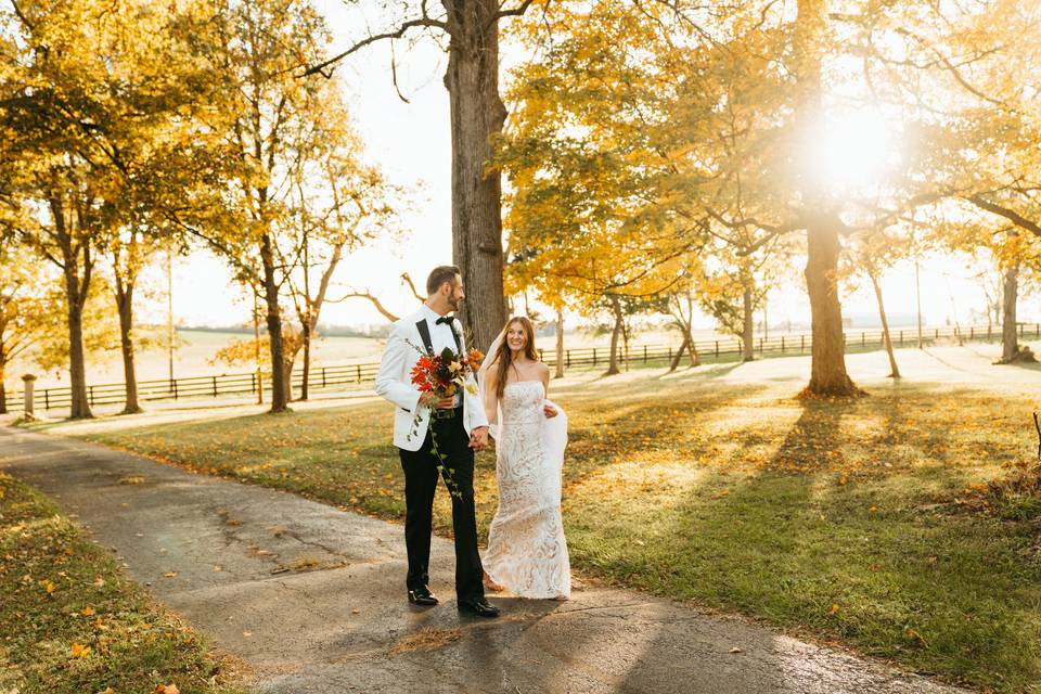 Bride groom sunset driveway