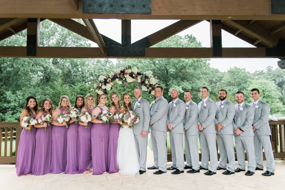 The couple with the bridesmaids and groomsmen