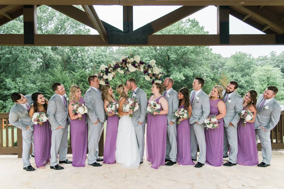 The couple with the bridesmaids and groomsmen