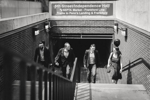 The band members walking up the subway