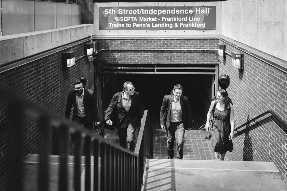 The band members walking up the subway