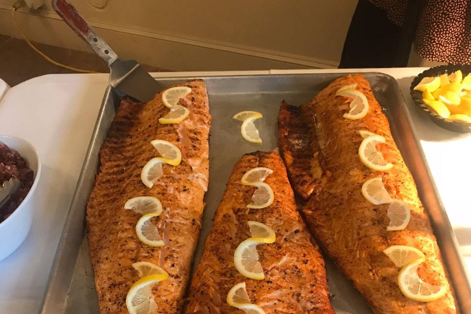 Grilled salmon garnished with lemon