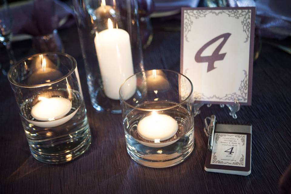 Table numbers and and matching booklet for guest to put their good wishes and advice for the couple. Anniversary book coincides with the guest table.