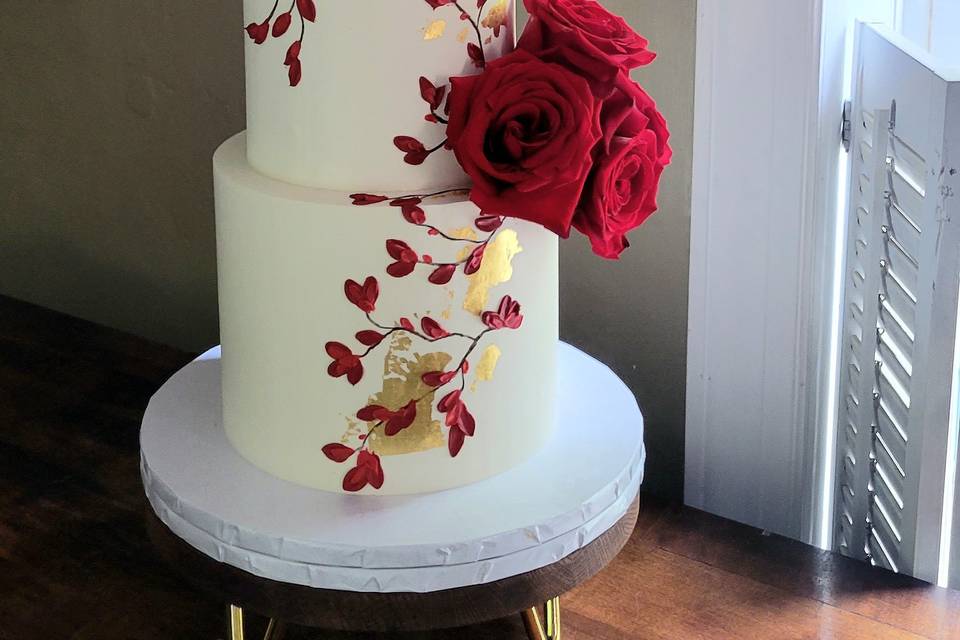 Red and gold wedding cake