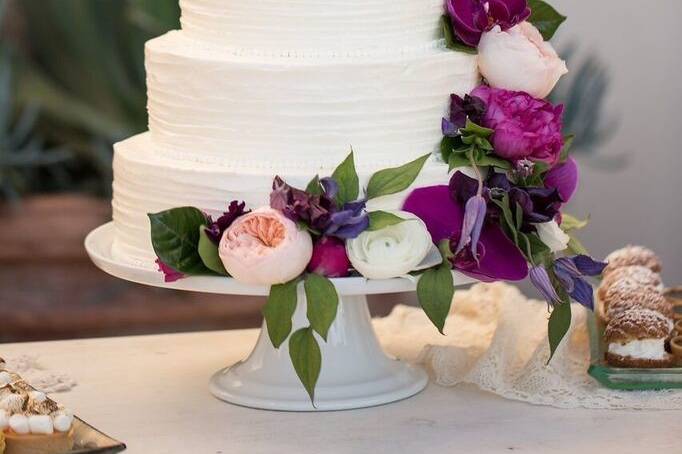 A beautiful simple cake enhanced by your florist.