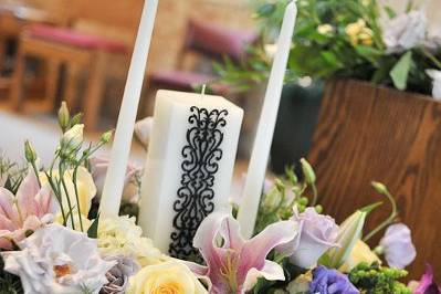 Unity candle used at the ceremony will be taken to the reception and decorate the head table.