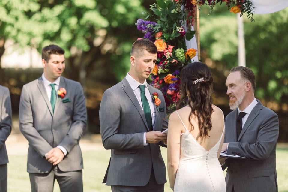 Groom reads his vows.