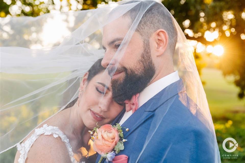 Happy Couple under the veil