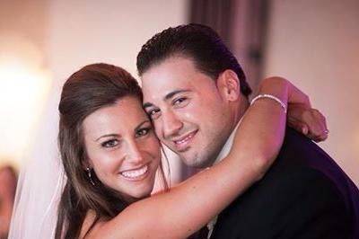 Newlyweds pose for a photo