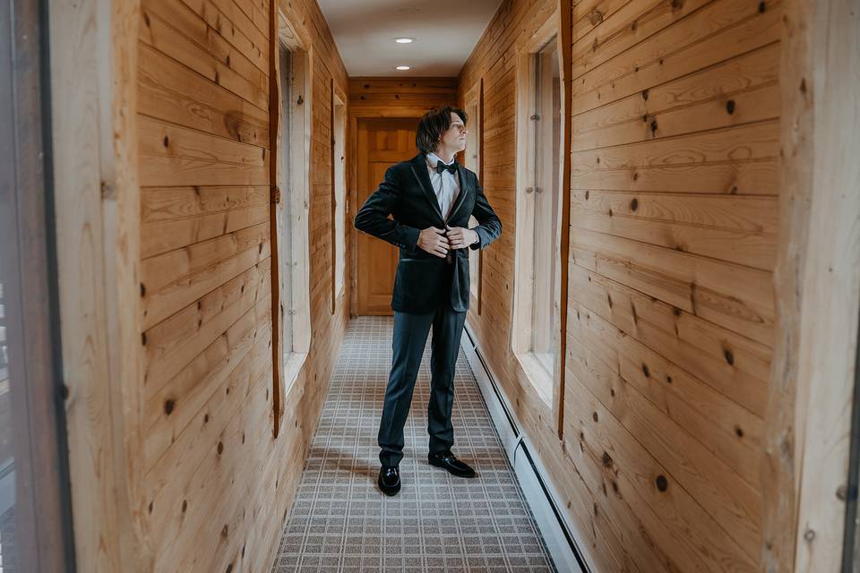 Groom getting ready in cabin