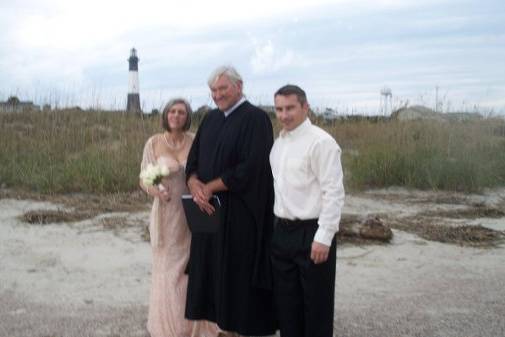 Couple with the wedding officiant