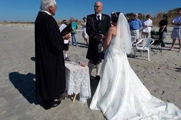 Couple with the wedding officiant