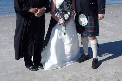 Couple with the wedding officiant