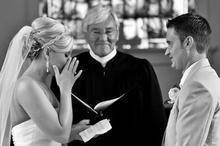 Couple with the wedding officiant