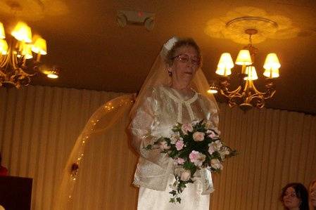 Ivory satin three piece wedding dress with pill box hat and veil
