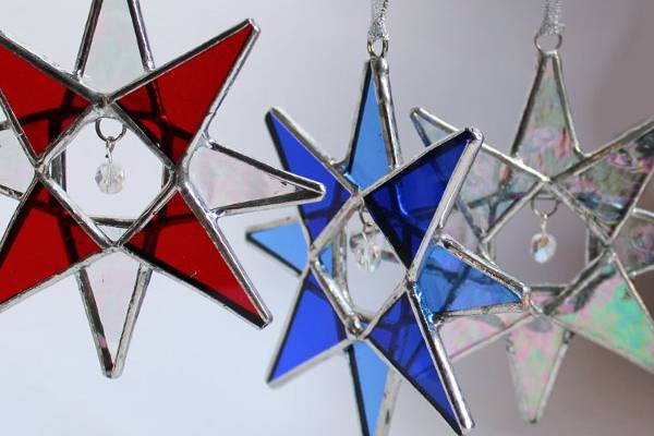 Handmade 8 pointed 3-D glass star with clear crystal bead center.