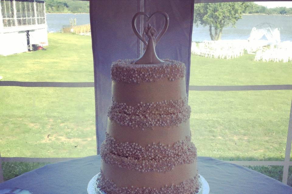 Three Tier Sugar Pearl Wedding CakeBlue Velvet Inside with Cream Cheese IcingLayered with Fresh Strawberries inside each tier!Finished with Sugar Pearls at Base & Top of each Tier