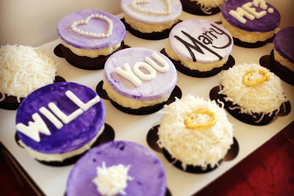 Proposal Cupcakes!Chocolate Cupcakes with Coconut Buttercream FrostingCustom Fondant Toppers