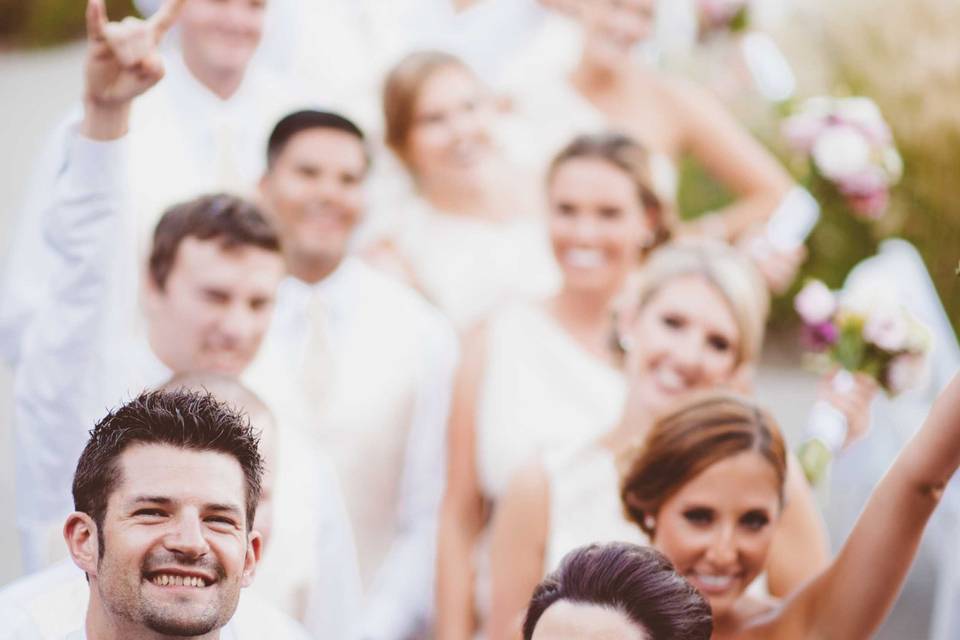 The couple with the bridesmaids and groomsmen