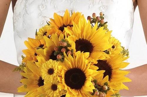 A delightful bouquet of sunflowers and pomps with an accent of berries.