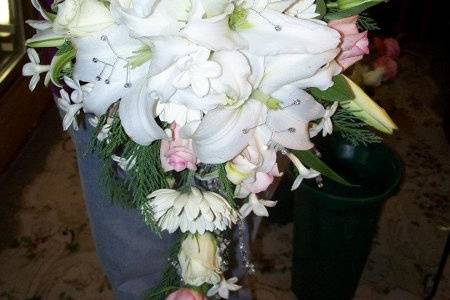 Winter cascade of Casablance Lilies, pink roses and stephanotis.