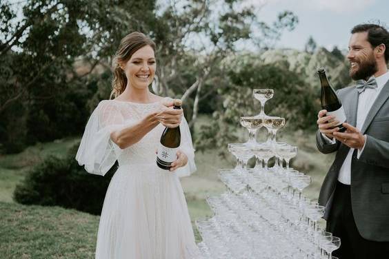 Newlyweds with champagne tower