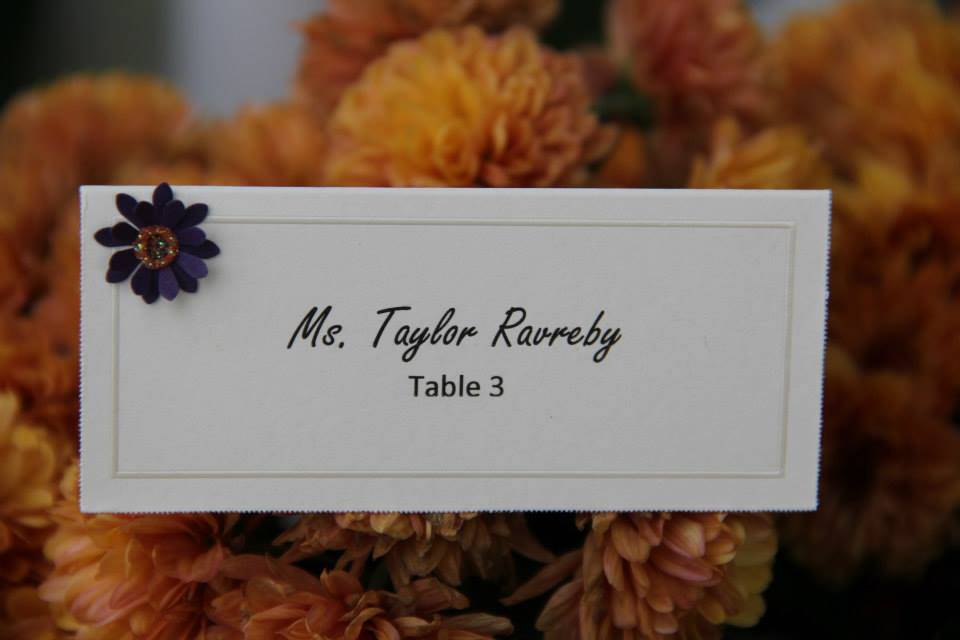 Place card with floral embellishment