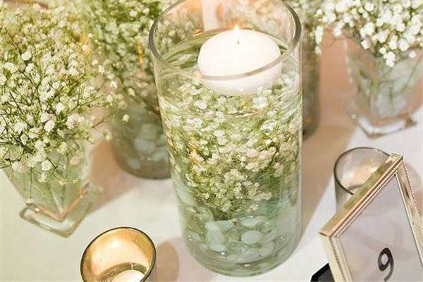 Candles with flowers as centerpiece
