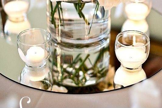 Candles with flowers as centerpiece