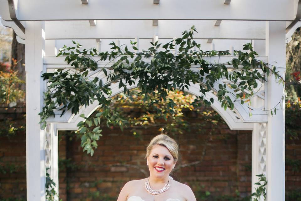 For this bride, the pergola in the Burgwin-Wright House orchard was decorated with additional greenery.