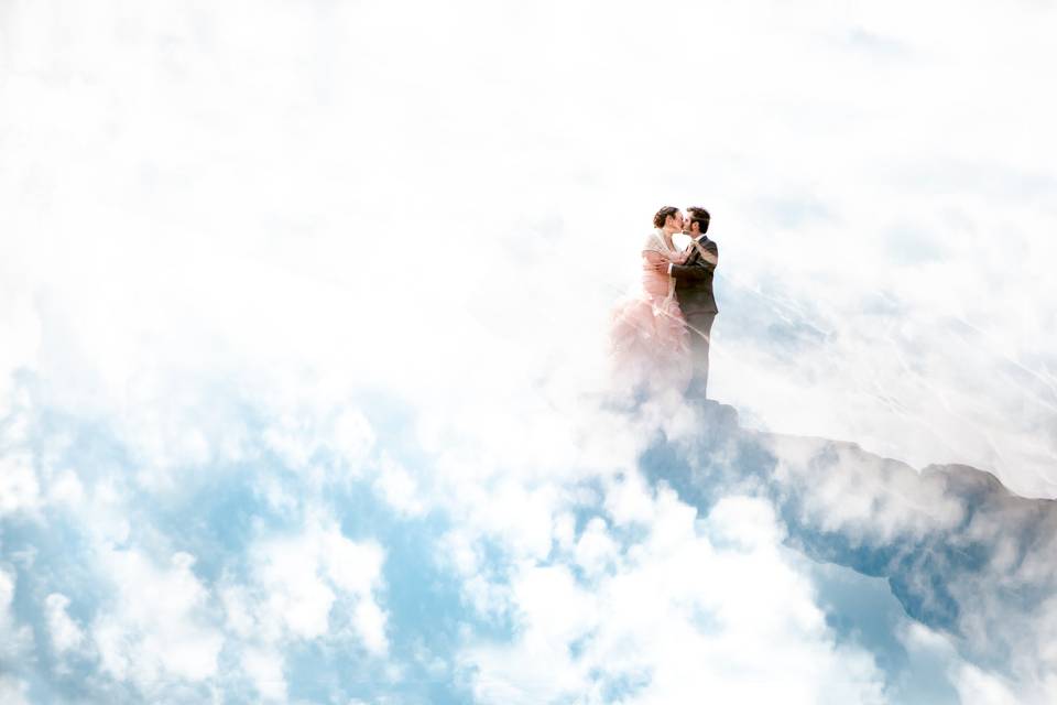 Wedding couple in the clouds