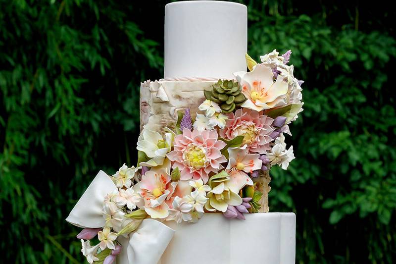 White wedding cake with flower decors