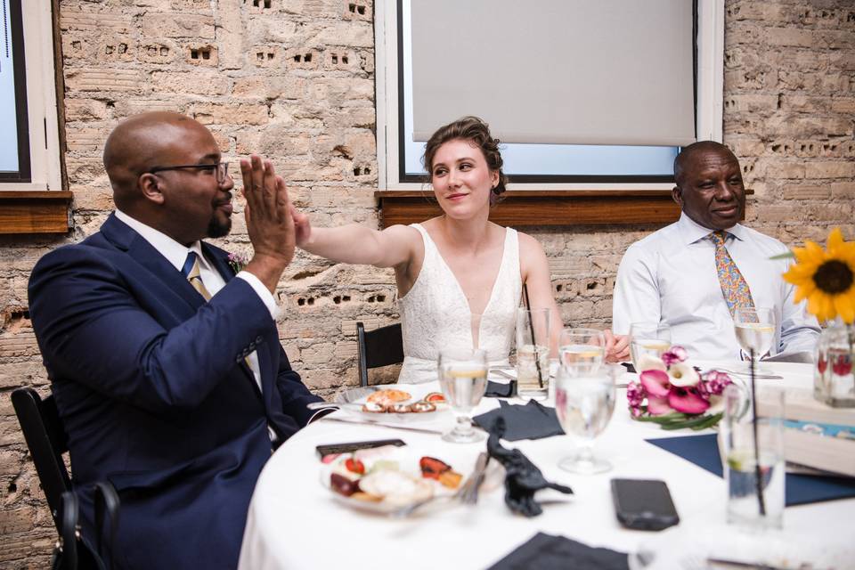 Bride and groom high five