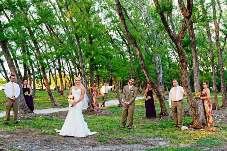 Newlyweds and their guests in the woods