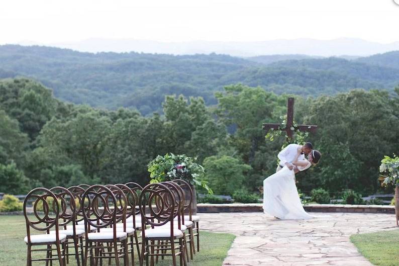 The couple in the outdoor wedding venue