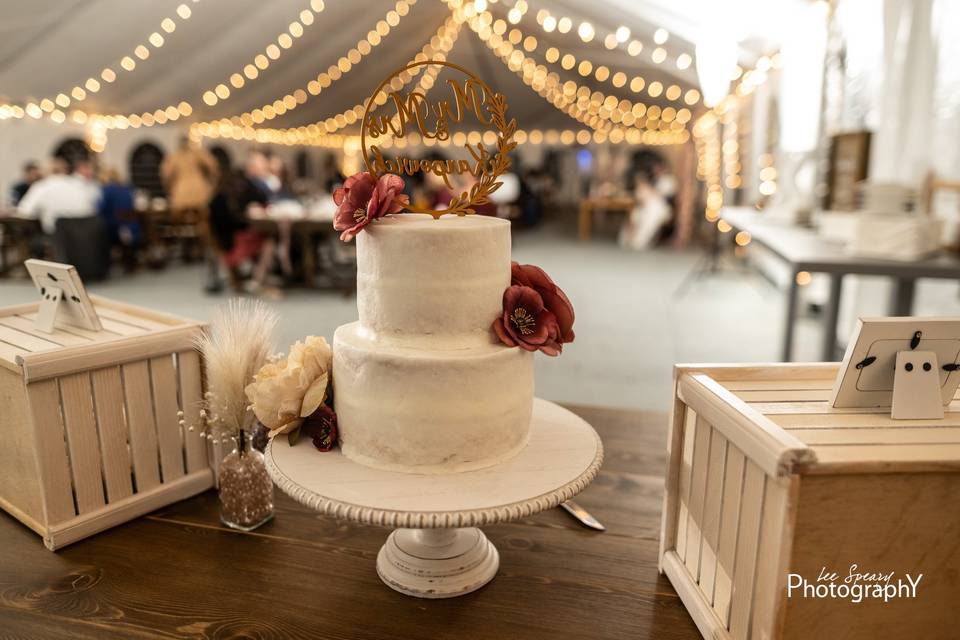 Wedding cake under bistro ligh