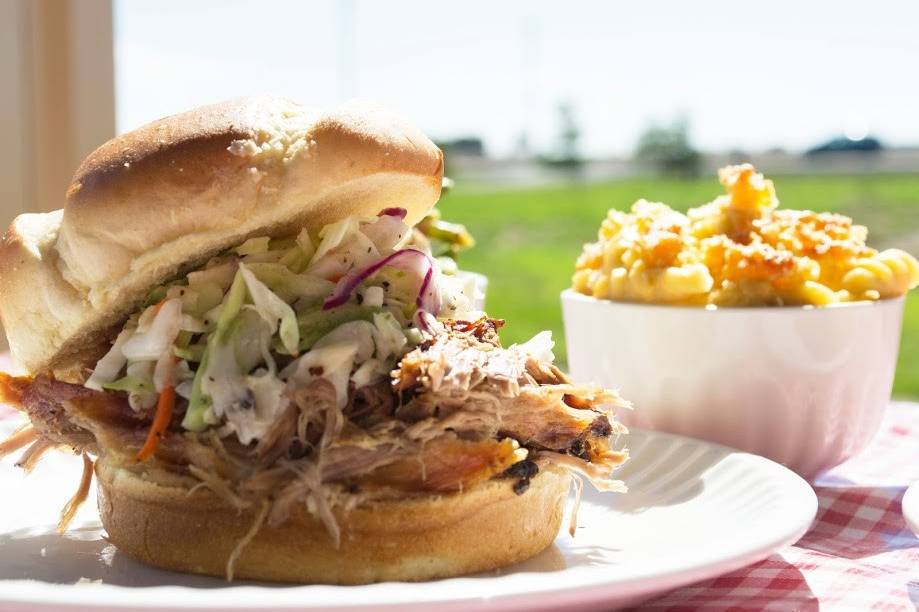 Pulled Pork Sandwich on a Brioche Bun topped with fresh cole slaw and served with a side of scratch made mac & cheese.
