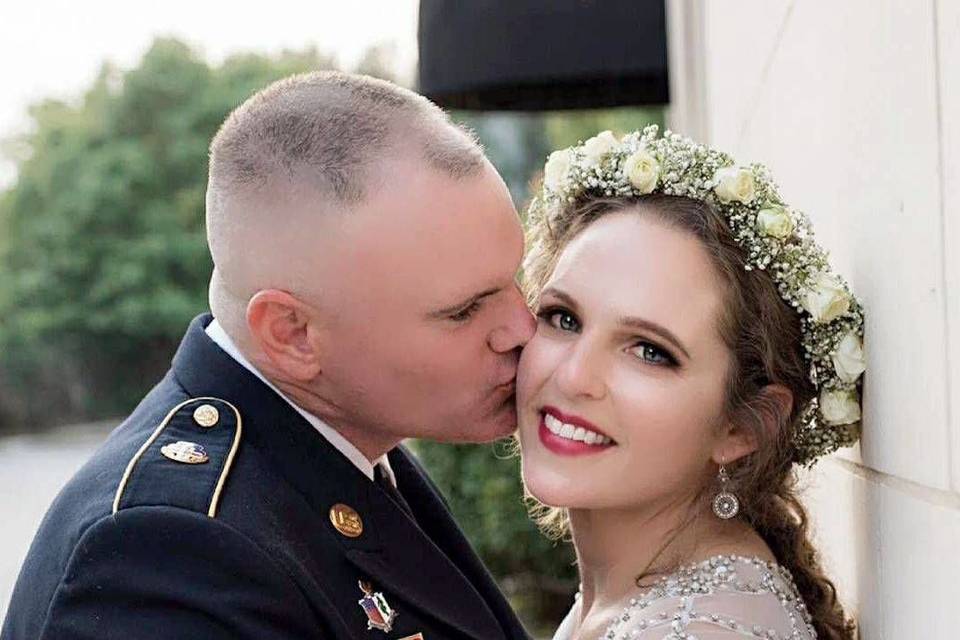 Groom kisses his bride