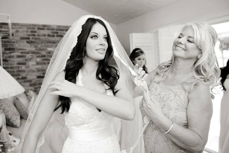 Assisting the bride with her veil