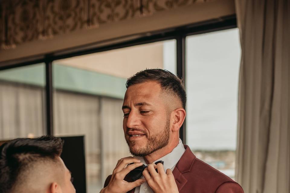 Son fixes his father's bowtie