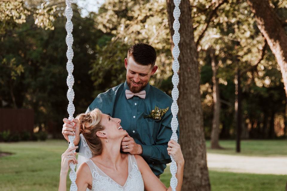 Bride and groom on swing