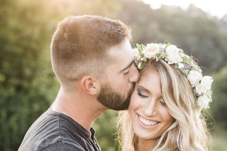 Groom giving kisses