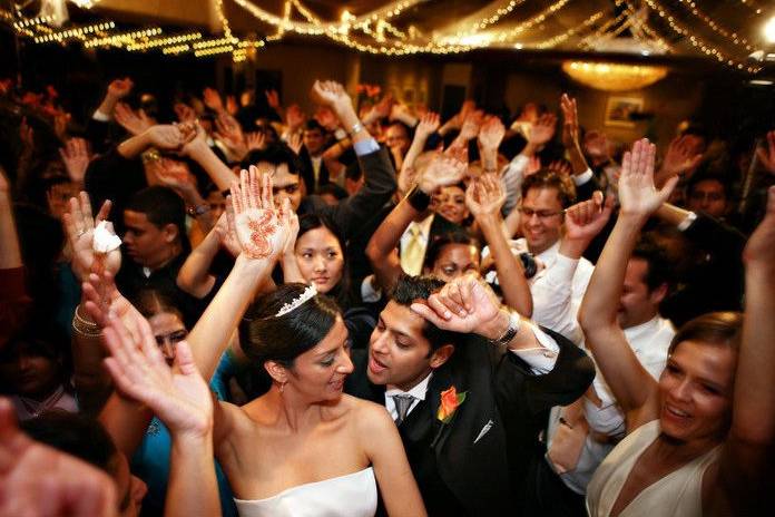 Couple dancing with guests