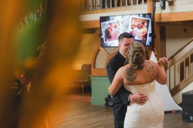 First dance with a photo montage backdrop | Photo credit: Millyard Studios