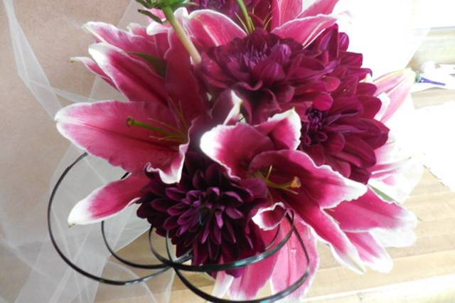 Dark stargazer lily, burgundy dahlias, bear grass