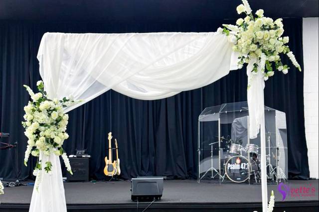 Timeless white wedding arch